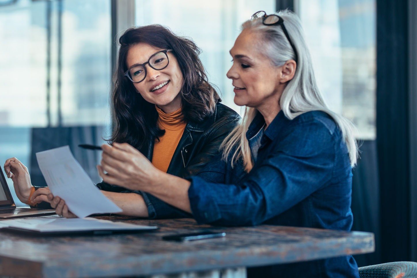 Professional woman engaged in a meaningful conversation representing transition mentoring work